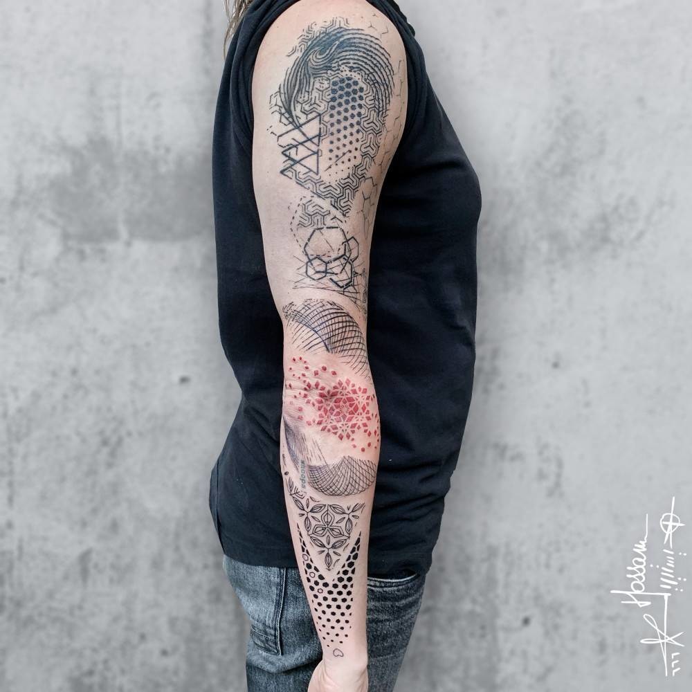 Abstract geometric tattoos on the right arm